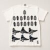 White tee hand printed with rows of pinecones and leaves above six pigeons